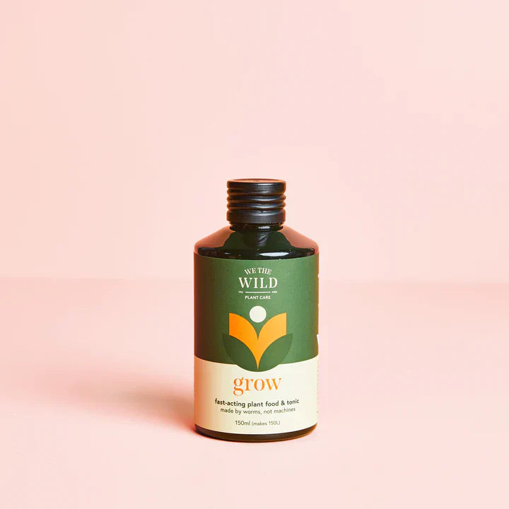 Grow 150ml fast-acting plant food and tonic bottle with green and cream label on pink background